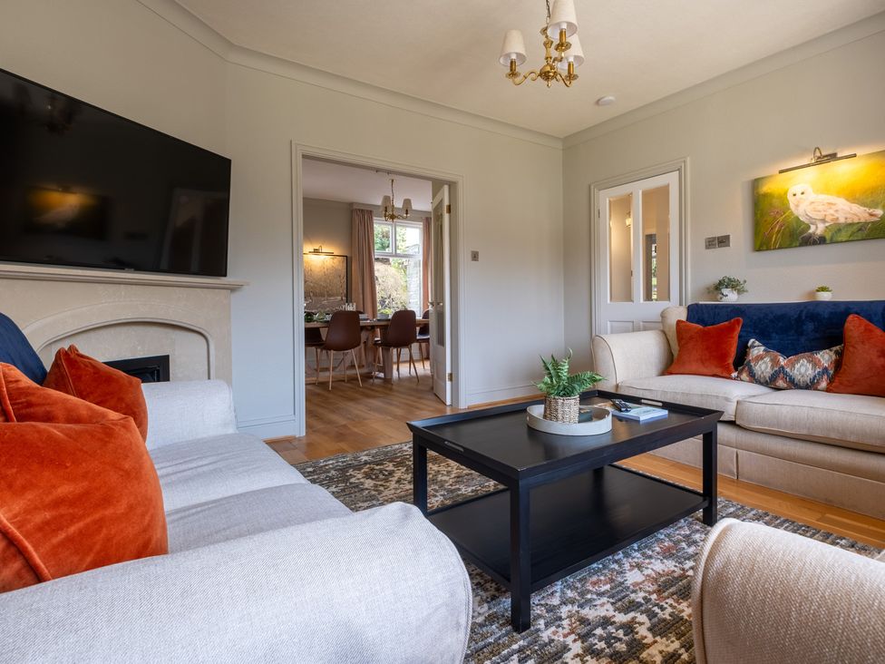 A living room with a sofa and coffee table at Marina View in Bowness-On-Windermere