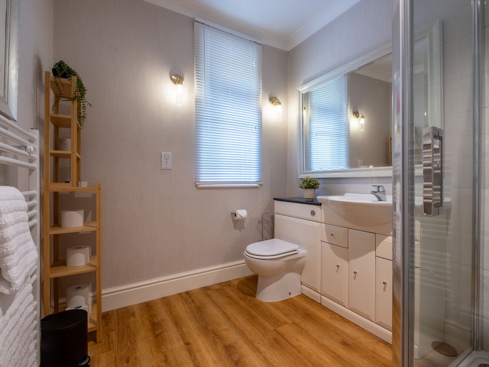 A bathroom with a sink and shower at Marina View in Bowness-On-Windermere