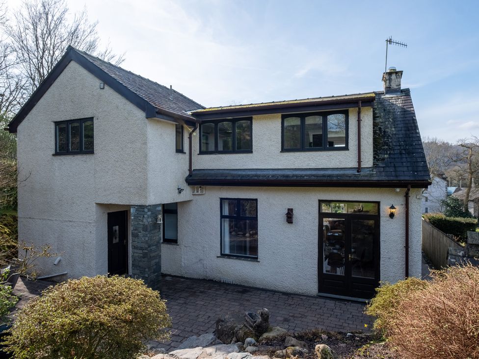 A house with multiple windows and a pathway at Marina View in Bowness-On-Windermere