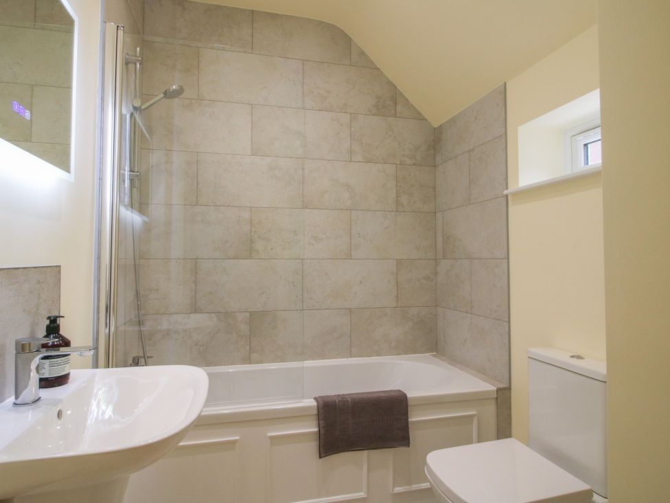 A bathroom with a bathtub and shower at Old Piggery in Shifnal