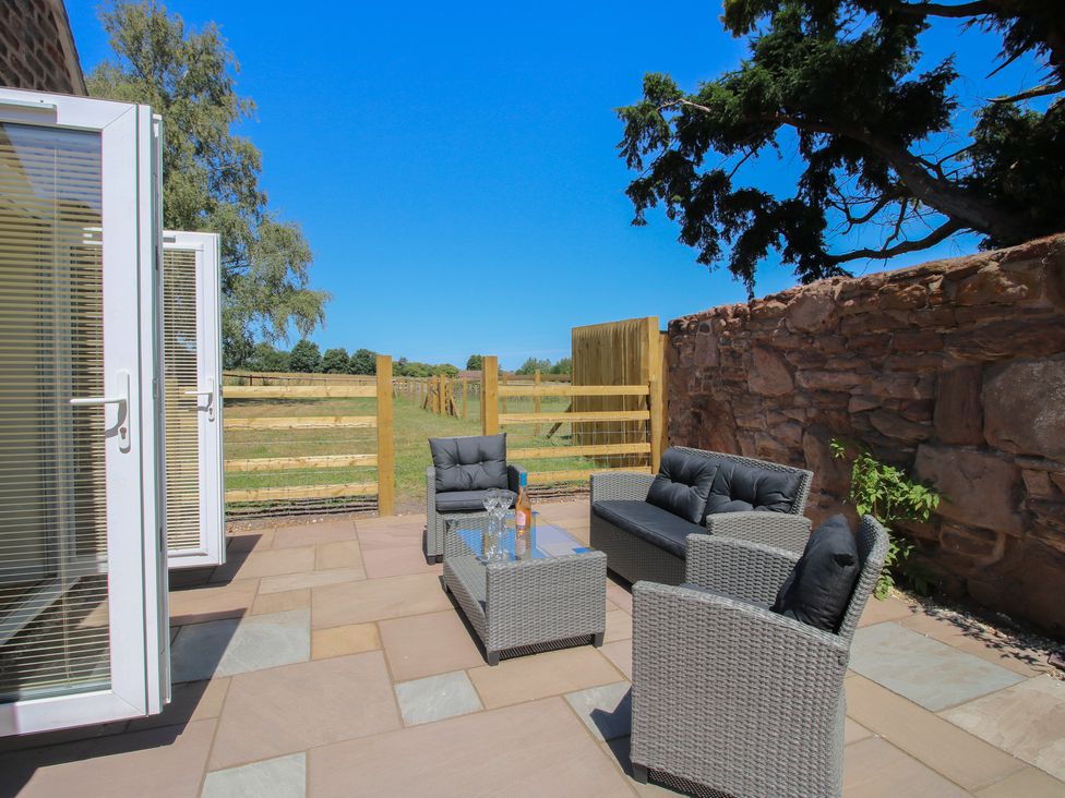 An outdoor seating area with furniture and a view at The Old Piggery in Ironbridge