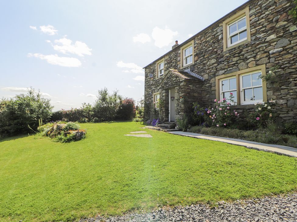 A stone house with garden and pathway at High Wood Foot, Bampton, Cumbria