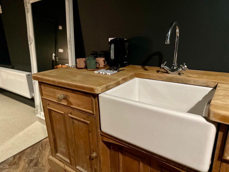A kitchen with a sink and countertop at The Balmoral Coach House in Morecambe