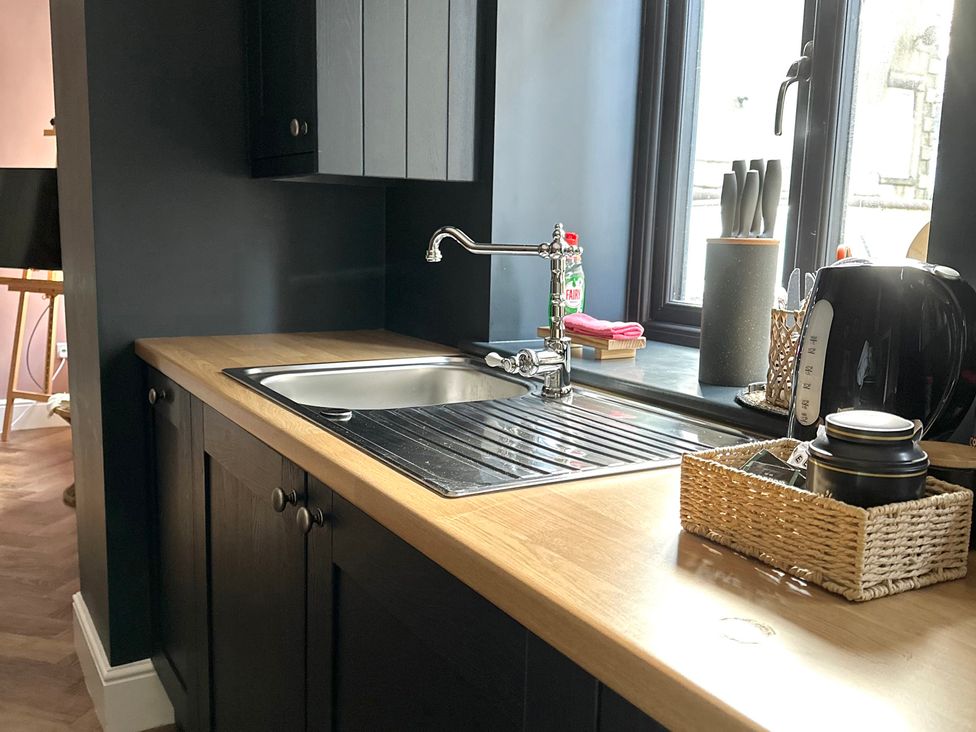 A kitchen with sink and kettle at The Balmoral Coach House in Morecambe