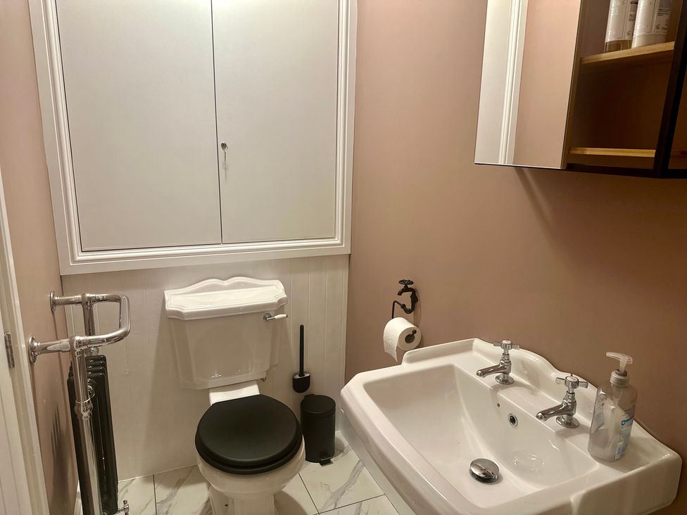 A bathroom with a toilet and sink at The Balmoral Coach House in Morecambe