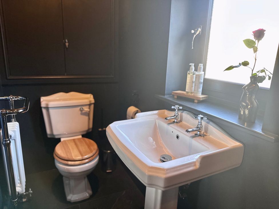 A bathroom with a sink and toilet at The Balmoral Coach House in Morecambe