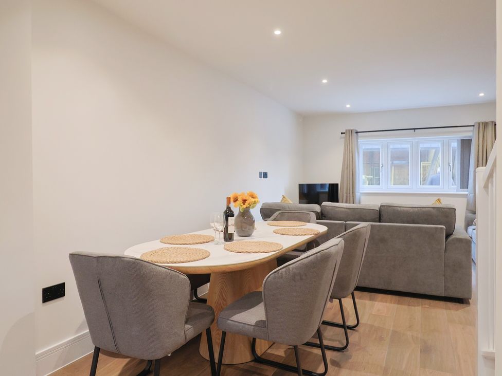 A dining room with a table and chairs at Oak Lodge Westonzoyland nr. Bridgwater