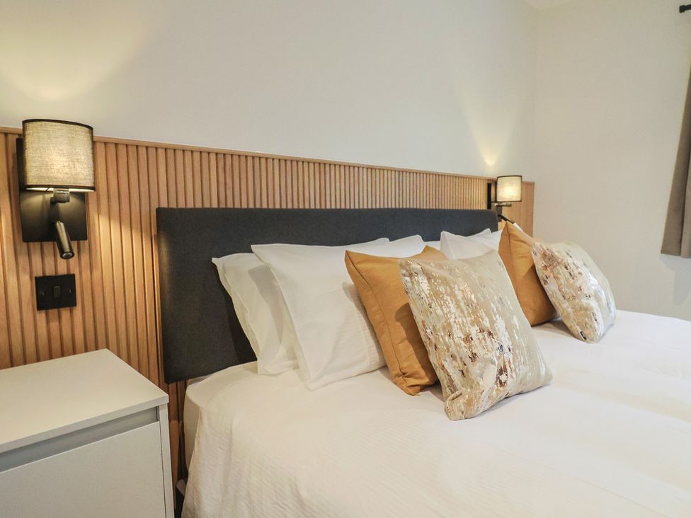 A bedroom with two beds and pillows at Oak lodge Westonzoyland nr. Bridgwater