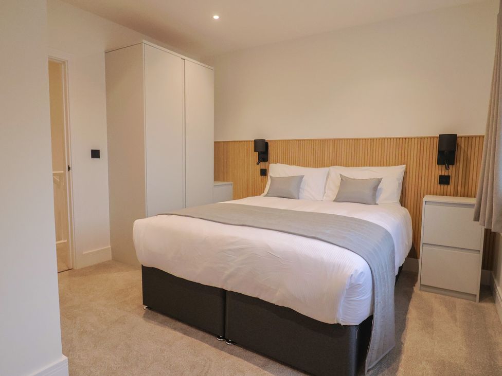 A bedroom with a bed and wardrobe at Oak lodge Westonzoyland nr. Bridgwater