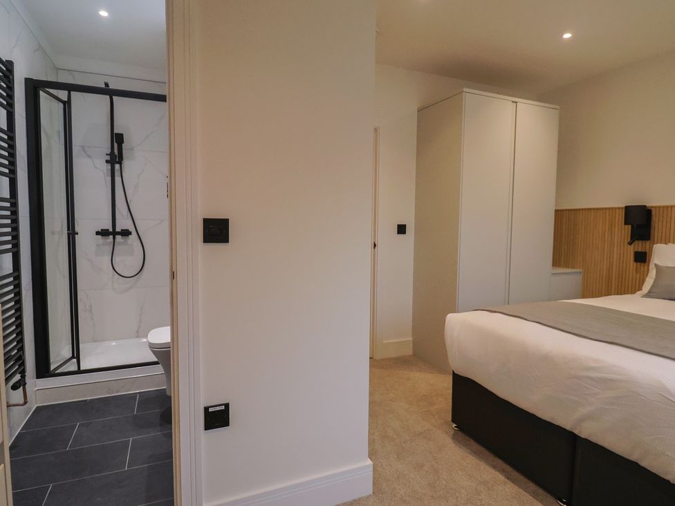 A bathroom with a shower and toilet at Oak lodge Westonzoyland nr. Bridgwater