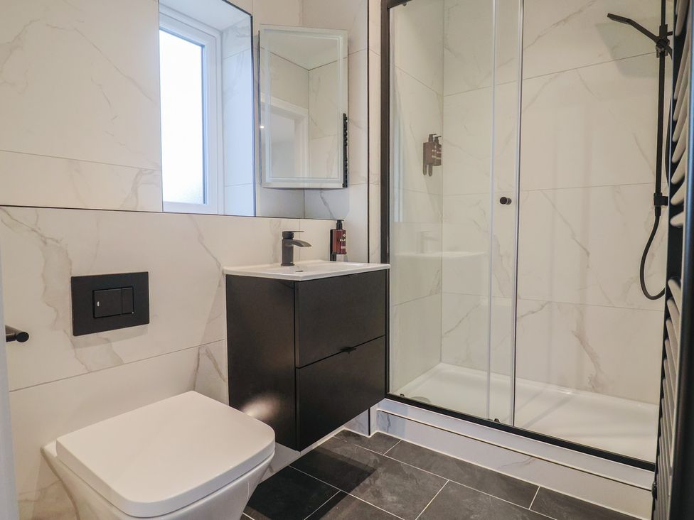 A bathroom with a sink and shower at Oak lodge Westonzoyland nr. Bridgwater