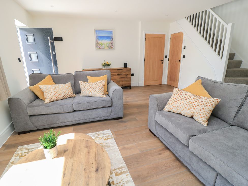 A living room with sofas and a coffee table at Oak Lodge Westonzoyland nr. Bridgwater