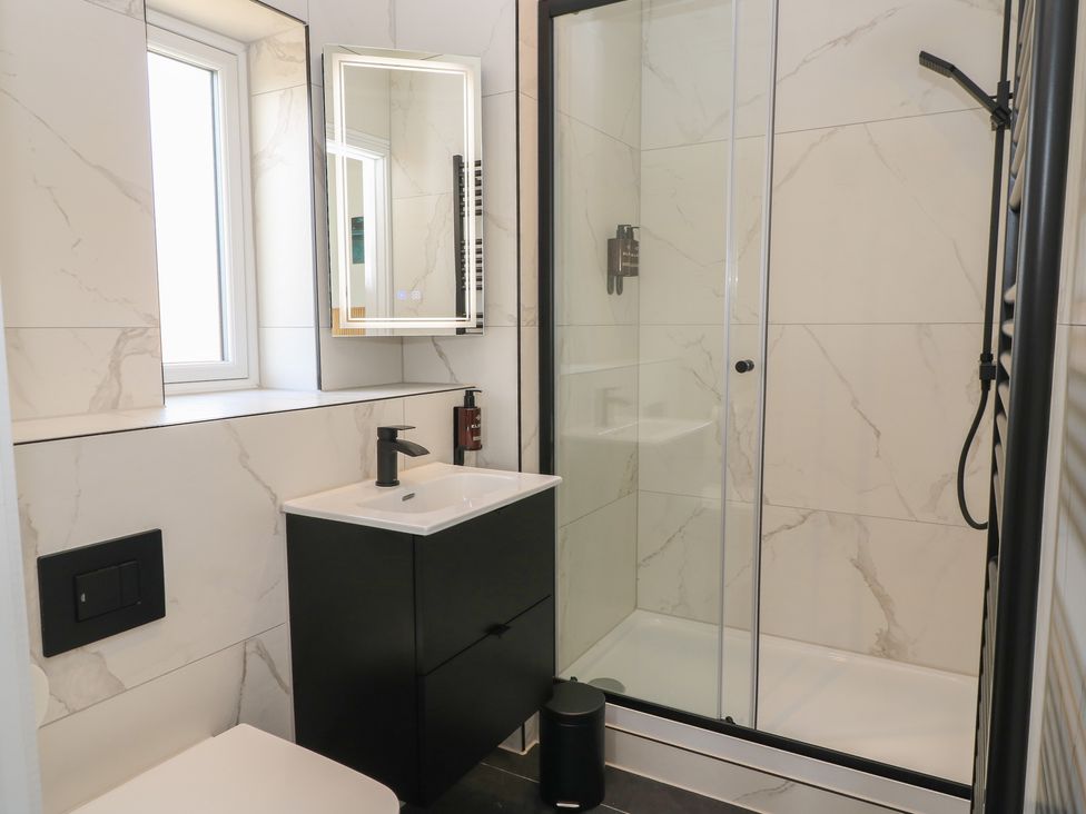 A bathroom with a shower and sink at Oak Lodge Westonzoyland nr. Bridgwater