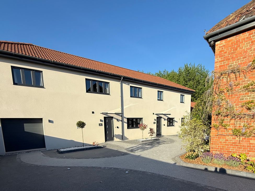 A building with windows and a garage at Oak Lodge in Westonzoyland nr. Bridgwater
