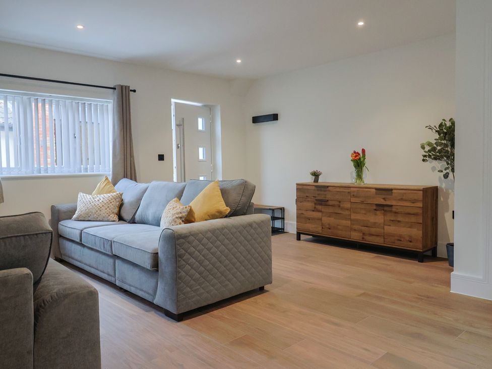 A living room with a sofa and sideboard at Pine Lodge Westonzoyland nr. Bridgwater