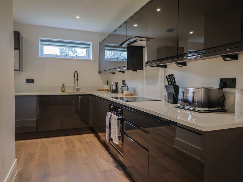 A kitchen with a sink and countertop at Pine Lodge Westonzoyland nr. Bridgwater