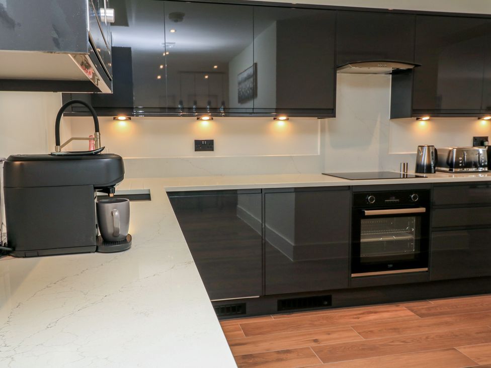 A kitchen with a coffee machine and oven at Pine Lodge Westonzoyland nr. Bridgwater