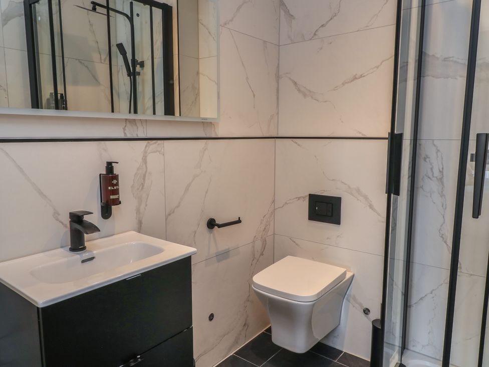 A bathroom with a sink and shower at Pine Lodge Westonzoyland nr. Bridgwater