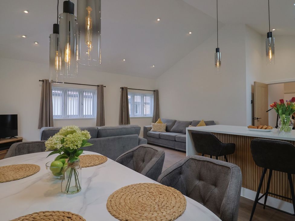 A living room with a sofa and television at Maple Lodge in Westonzoyland nr. Bridgwater
