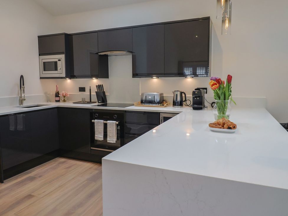 A kitchen with a sink, microwave, and coffee machine at Maple Lodge Westonzoyland nr. Bridgwater