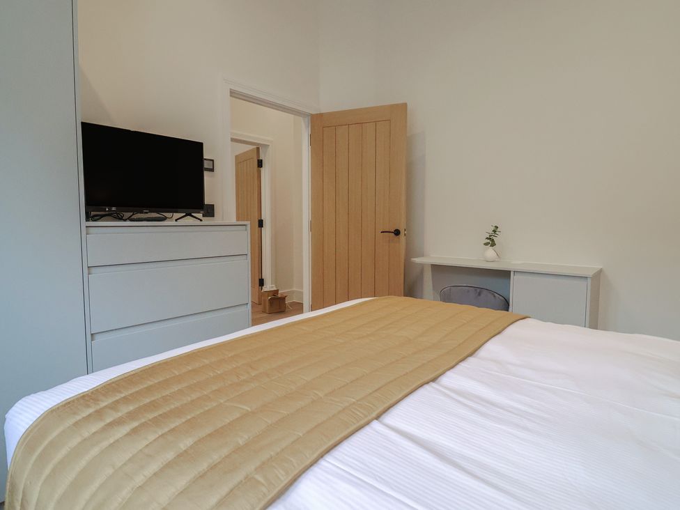A bedroom with a bed and television at Maple Lodge Westonzoyland nr. Bridgwater