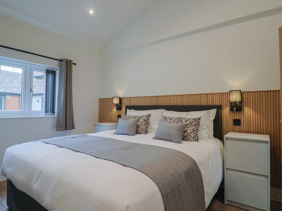 A bedroom with a bed and bedside table at Maple Lodge Westonzoyland nr. Bridgwater