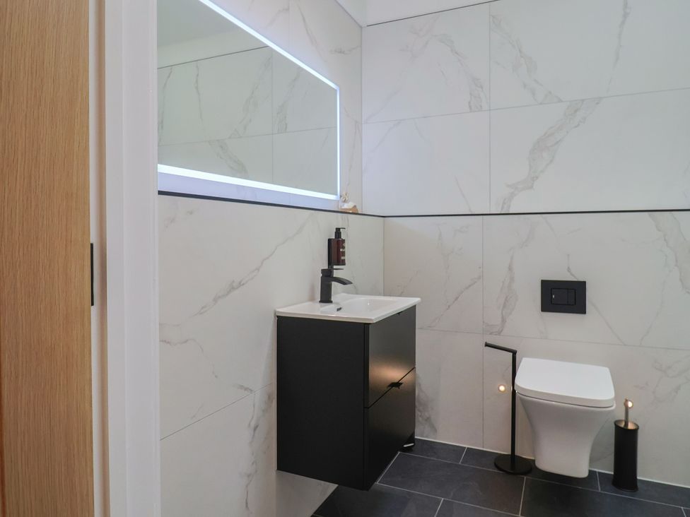 A bathroom with a sink and toilet at Maple Lodge Westonzoyland nr. Bridgwater