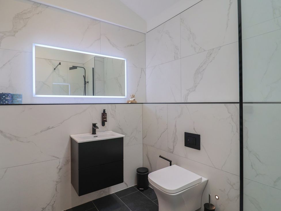 A bathroom with a sink and toilet at Maple Lodge Westonzoyland nr. Bridgwater