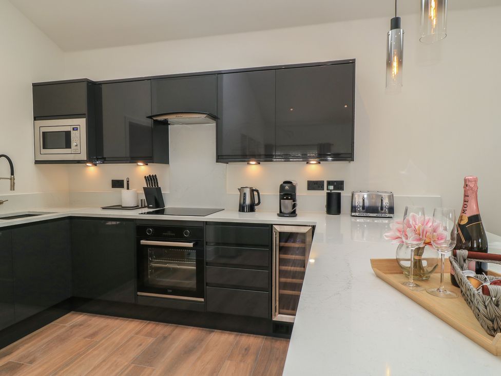 A kitchen with modern appliances and countertop at Maple Lodge Westonzoyland near Bridgwater