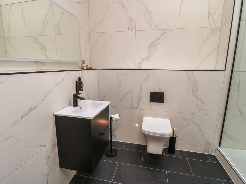 A bathroom with sink and toilet at Maple Lodge Westonzoyland near Bridgwater