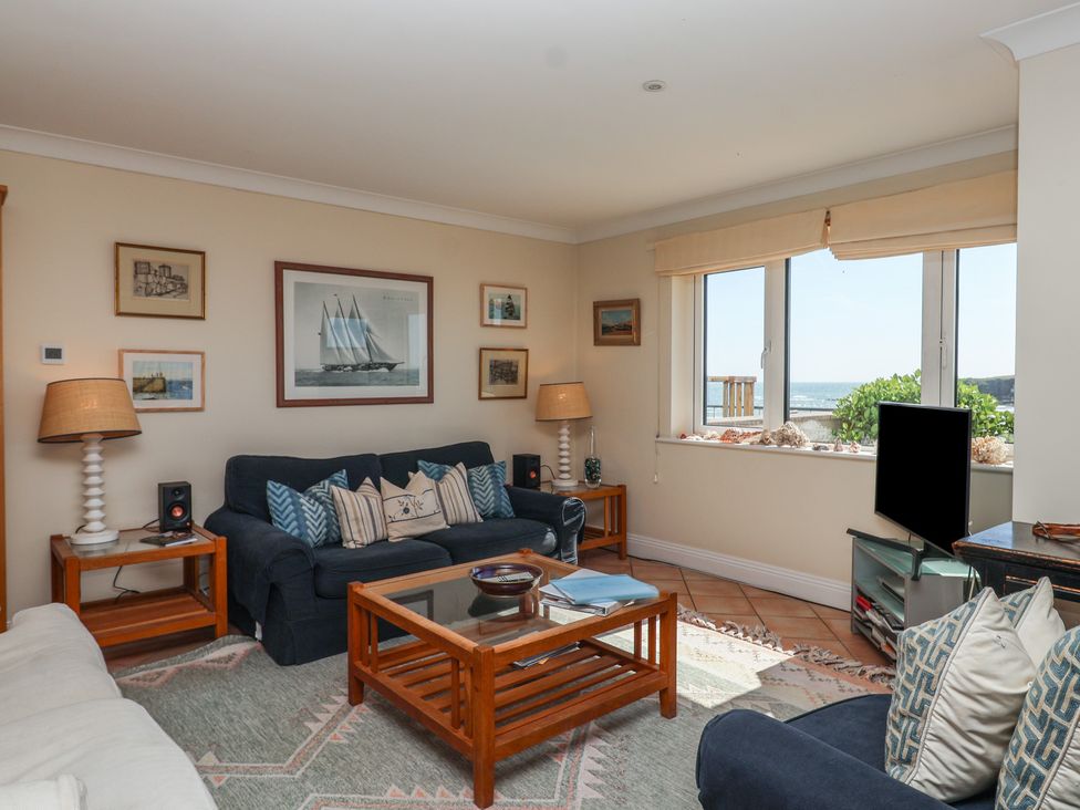 A living room with a sofa and coffee table at 6 Burgh Island in Bigbury-On-Sea