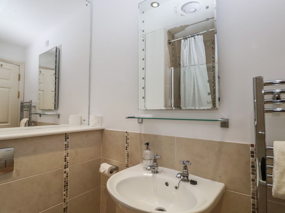 A bathroom with a sink and mirror at 6 Burgh Island Bigbury-On-Sea