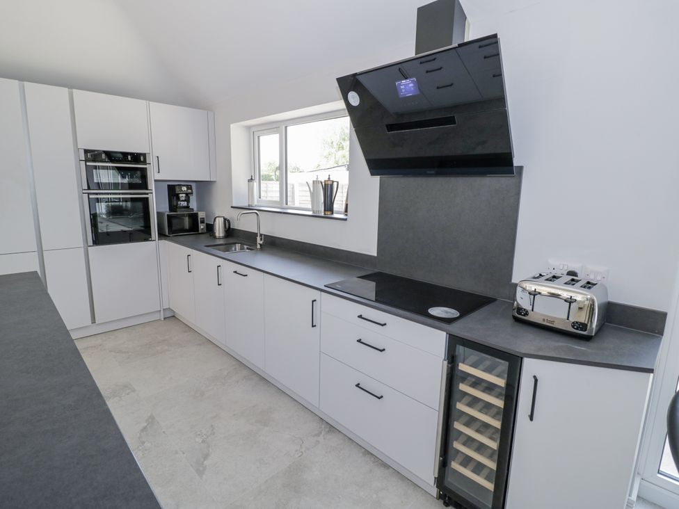 A kitchen with a sink and appliances at Chillon South Littleton near Honeybourne