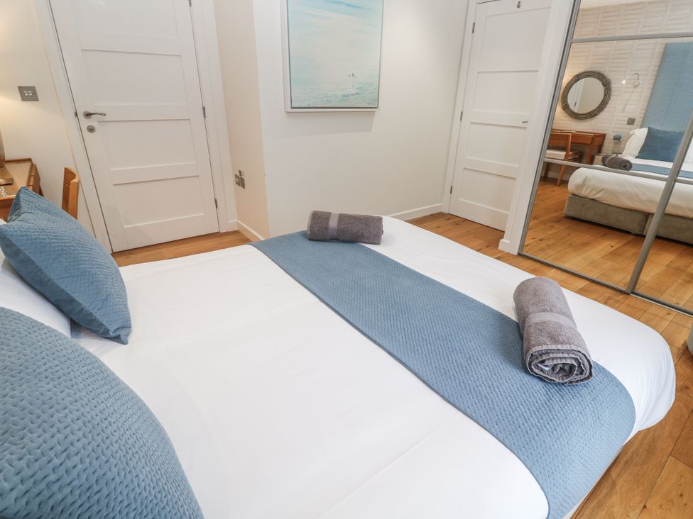 A bedroom with a bed and decor at The Black Barnacle in Portreath