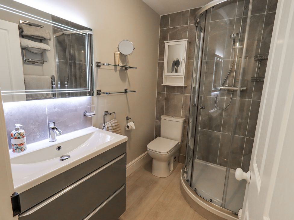 A bathroom with a shower and sink at Olive Cottage in Kirkby Stephen