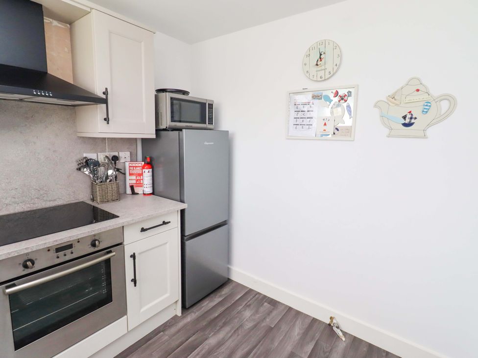 A kitchen with appliances and utensils at Sea Shore in Seahouses