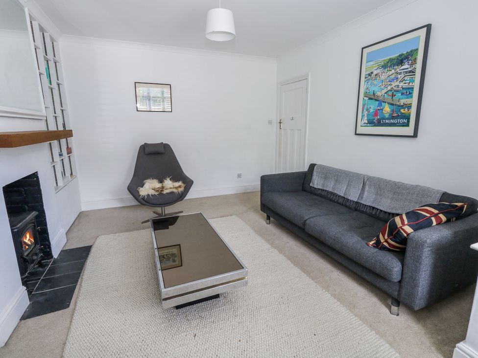 A living room with a sofa and chair at King Henry House in Lymington