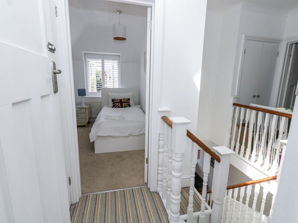 A landing with a view into a bedroom at King Henry House in Lymington