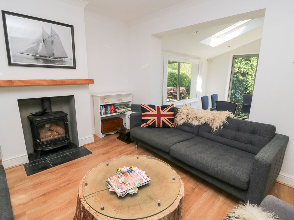 A living room with a sofa and coffee table at King Henry House in Lymington