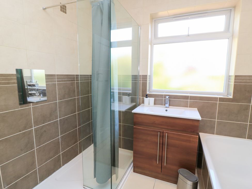 A bathroom with a shower and sink at King Henry House in Lymington