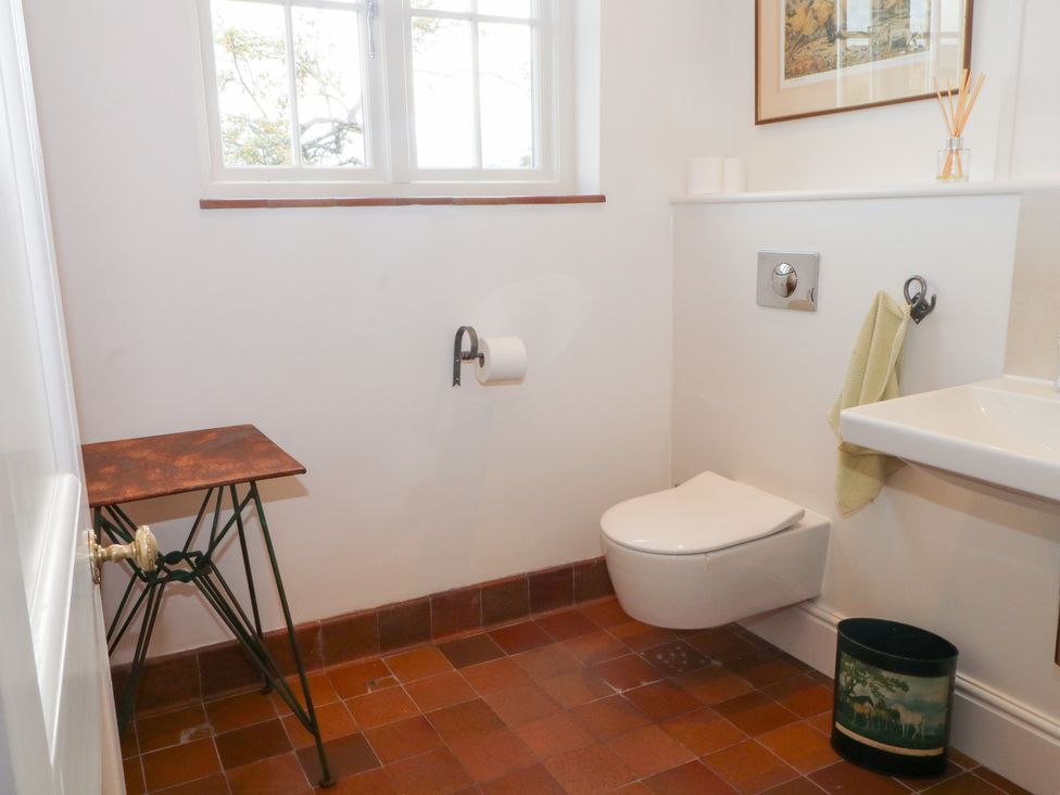 A bathroom with a toilet and sink at Higher Park Farm in Alderley Edge
