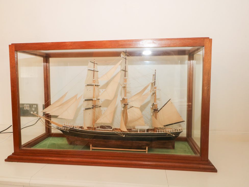 A ship model displayed in a glass case at Higher Park Farm in Alderley Edge