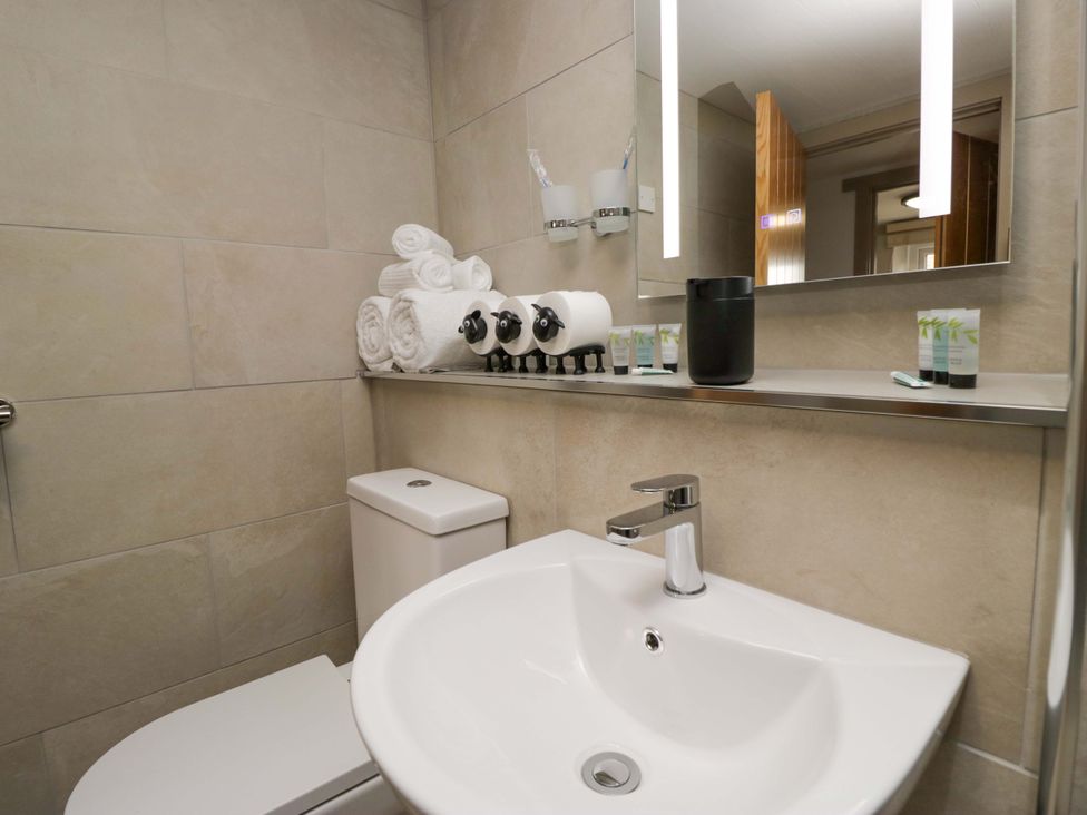 A bathroom with a sink and toilet at Yeat Stoup Cottage Cockermouth