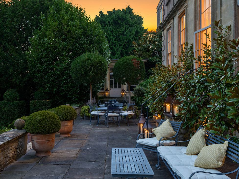 An outdoor area with seating and planters at Batheaston House Batheaston