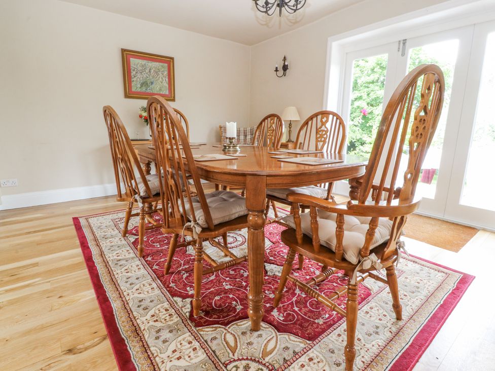 A dining room with a table and chairs at The Old Coach House in Bilsborrow
