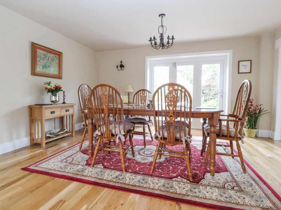A dining room with a table and chairs at The Old Coach House in Bilsborrow