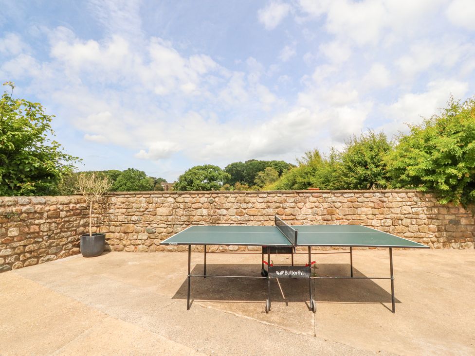 A table tennis table in an outdoor area at The Old Coach House Bilsborrow