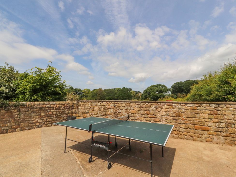 An outdoor area with a ping pong table at The Old Coach House in Bilsborrow
