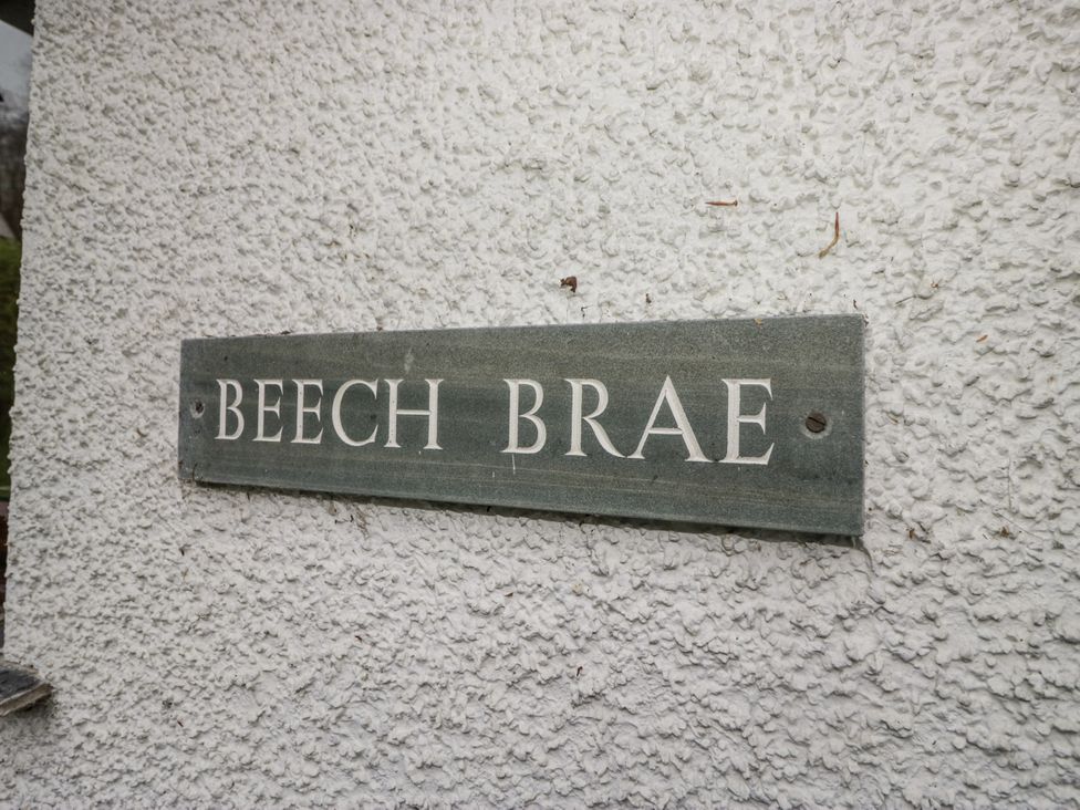 A sign reading BEECH BRAE on a wall at Beech Brae in Kendal