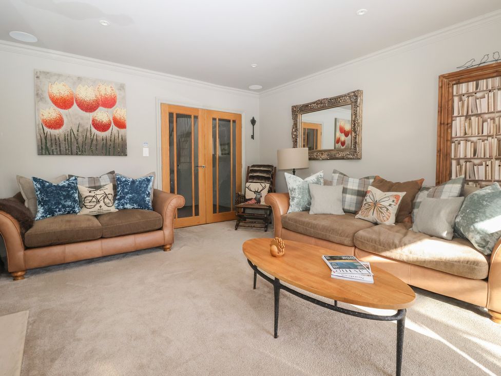 A living room with a sofa and coffee table at Johns Cottage in Hampsthwaite